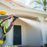 Soft wash cleaning process for a home's exterior by professionals in Kissimmee, FL.