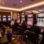 Players engaging with slot gacor machines, showcasing vibrant animated screens and excitement in a luxurious casino.